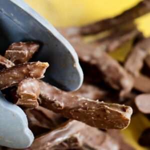Mangos confitados	con cobertura de chocolate con esencia de ron